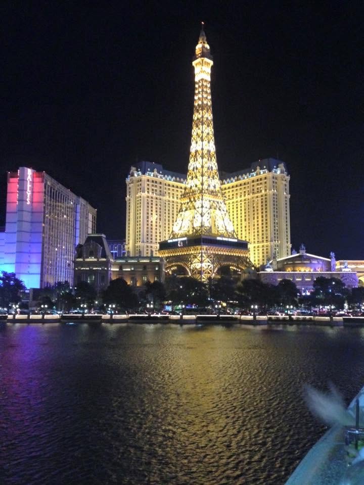 Illuminated Paris Las Vegas Eiffel Tower and hotel at night.