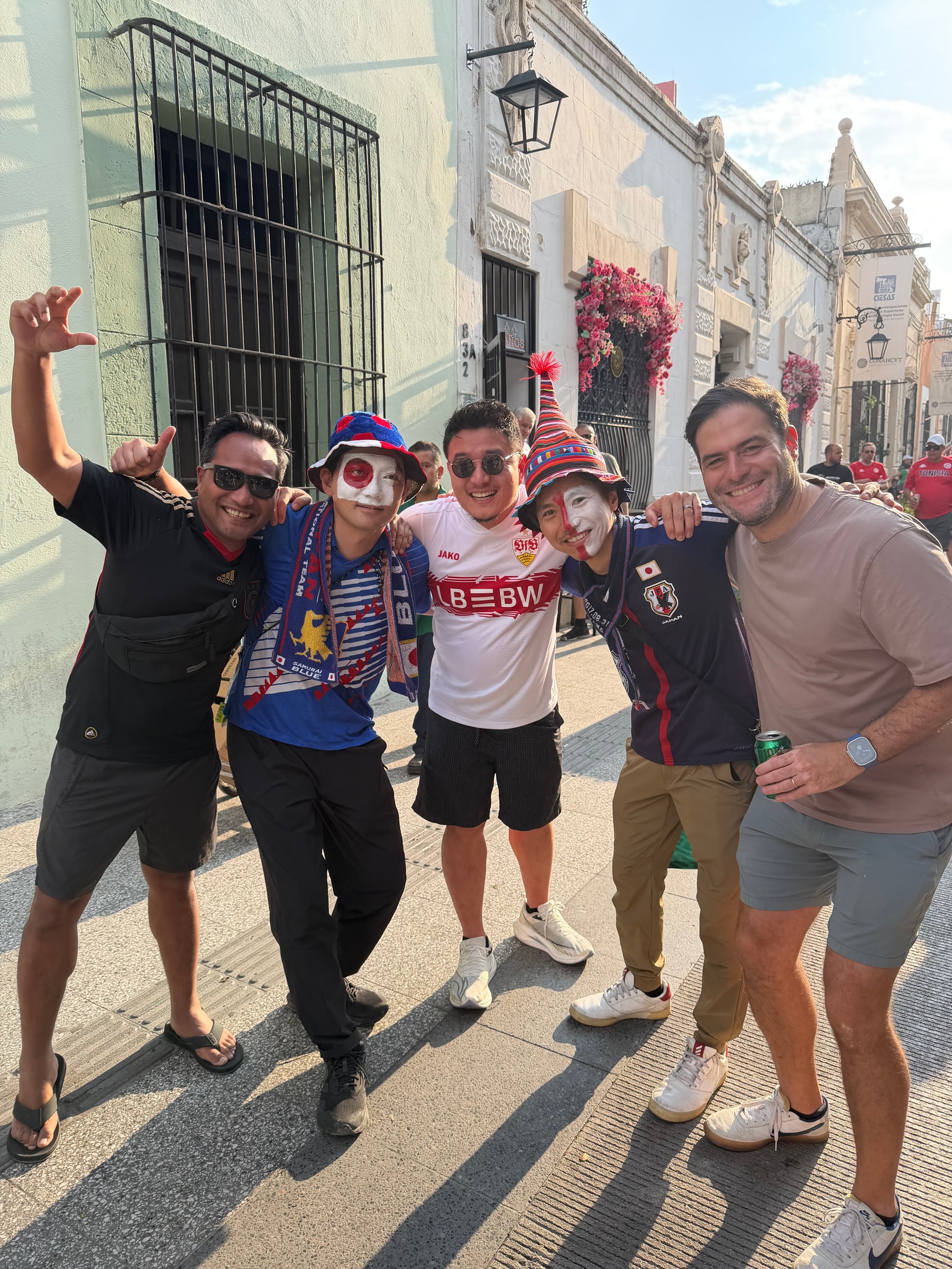 Five friends posing together during a World Cup trip in Mexico.