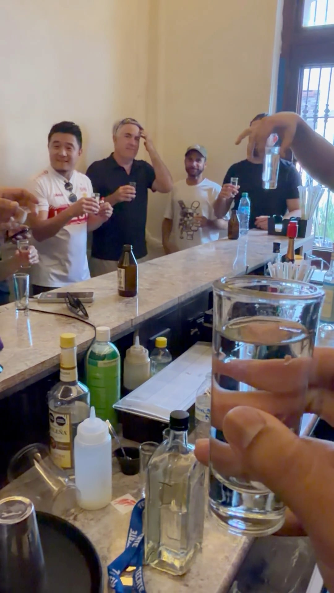 Friends raising glasses together during their trip in Mexico.